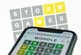 Playing Wordle, a single-player puzzle that combines elements of several games — including Scrabble and Battleship, has become popular on social media lately. Jakub Porzycki photo/NurPhoto