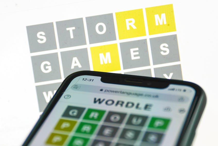 Playing Wordle, a single-player puzzle that combines elements of several games — including Scrabble and Battleship, has become popular on social media lately. Jakub Porzycki photo/NurPhoto