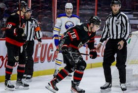Ottawa Senators right wing Drake Batherson (19) limps off the ice against the Buffalo Sabres during the first period at the Canadian Tire Centre on Tuesday, Jan. 25,2022.  
