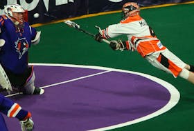 Buffalo Bandits Ian MacKay stretches out on his shot against Halifax Thunderbirds goalie Warren Hill during a National Lacrosse League game in Halifax on March 8, 2020. - Tim Krochak / The Chronicle Herald