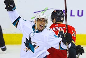 San Jose Sharks' Evander Kane celebrates after scoring against the Calgary Flames at the Scotiabank Saddledome in Calgary on on March 16, 2018.