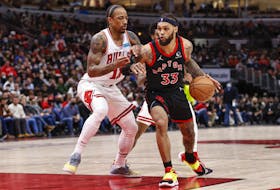 Toronto Raptors guard Gary Trent Jr. (33) drives to the basket against Chicago Bulls forward DeMar DeRozan (11) during the second half at United Center. 