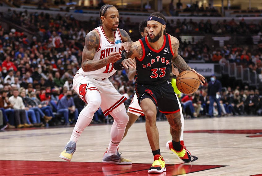 Toronto Raptors guard Gary Trent Jr. (33) drives to the basket against Chicago Bulls forward DeMar DeRozan (11) during the second half at United Center. 