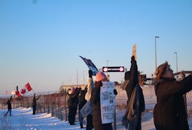 Dozens of people gathered in Borden-Carleton on Thursday, Jan. 27 to watch the truckers heading across the Confederation Bridge and show their support for the Freedom Convoy in Ottawa.