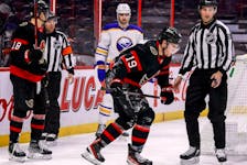 Nova Scotia's Drake Batherson limps off the ice after being injured by Buffalo Sabres goalie Aaron Dell during Tuesday's NHL game in Ottawa.