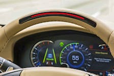 A steering wheel light bar and cluster icons indicates the status of Super Cruise™ and will prompt the driver to return their attention to the road ahead if the system detects driver attention has turned away from the road too long. Handout/Cadillac