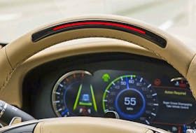 A steering wheel light bar and cluster icons indicates the status of Super Cruise™ and will prompt the driver to return their attention to the road ahead if the system detects driver attention has turned away from the road too long. Handout/Cadillac