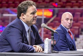 Kent Hughes listens to executive vice-president of hockey operations Jeff Gorton during a news conference introducing Hughes as the Montreal Canadiens' new general manager at the Bell Centre in Montreal on Jan. 19, 2022. 