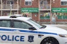 A Halifax Regional Police cruiser drives past Highfield Video & Variety in Dartmouth on Friday. A 12-year-old boy is accused of committing robberies at the store Thursday and one week earlier while armed with a pellet gun.