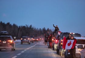 Motorists line up along the shoulder after the Big Stop exit on Highway 102 near Enfield early Thursday morning to show their support for truckers headed to Ottawa as part of the 'Freedom Convoy' today in Ottawa. A 'slow roll convoy' will be held today in Sydney starting at 1 p.m. ERIC WYNNE/SALTWIRE NETWORK