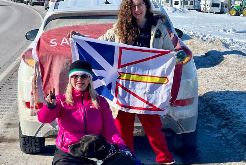  Lola Parsons (left) and Jennifer Whiteway pose with Monty the dog at a pitstop in Aulac, New Brunswick, on their way to Ottawa. Photo provided by Lola Parsons.
