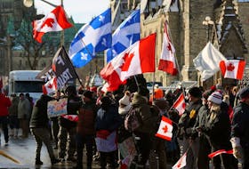 Supporters of the Freedom Convoy protest against Covid-19 vaccine mandates and restrictions in front of Parliament of Canada on Jan. 28, 2022 in Ottawa.