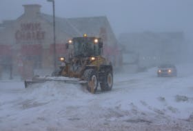 A snowplow in Charlottetown begins pushing back snow during a Jan. 29 blizzard. 