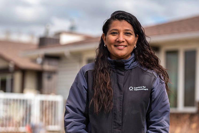  Centre for Newcomers CEO Anila Lee Yuen poses for a photo outside her house in Calgary on Saturday, May 1, 2021.