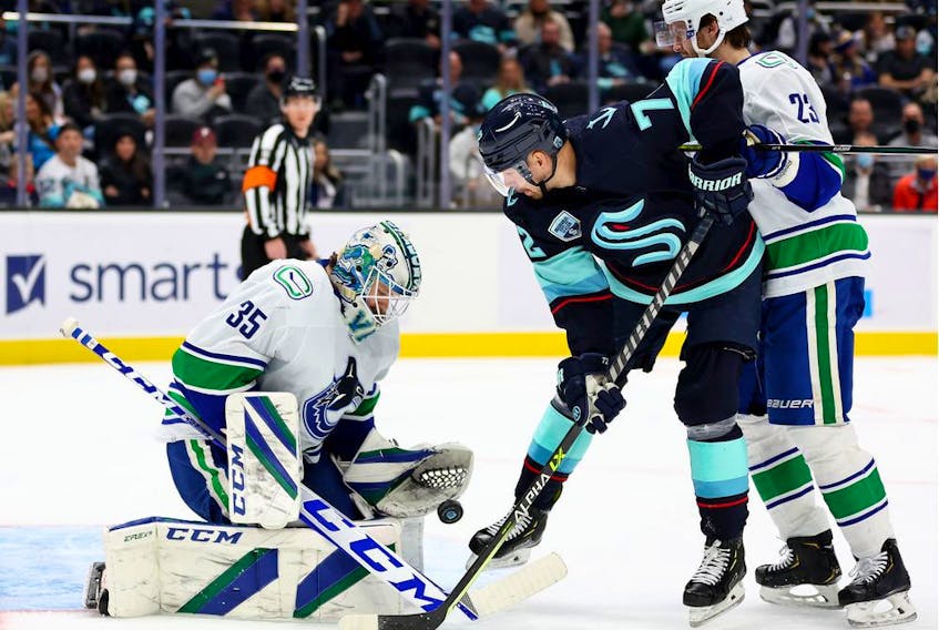  Thatcher Demko #35 of the Vancouver Canucks makes a save in front of Joonas Donskoi #72 of the Seattle Kraken during the second period at Climate Pledge Arena on January 01, 2022 in Seattle, Washington.