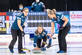 Nova Scotia skip Christina Black, centre, watches her shot as third Jenn Baxter, left, and lead Shelley Barker prepare to sweep during action against Team Canada at the Scotties Tournament of Hearts in Thunder Bay on Sunday morning. – Andrew Klaver/ Curling Canada