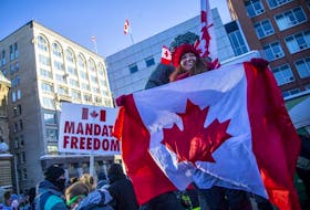 Thousands gathered in Ottawa's downtown core for a protest in connection with the Freedom Convoy that made their way from various locations across Canada, Saturday Jan. 29, 2022. 