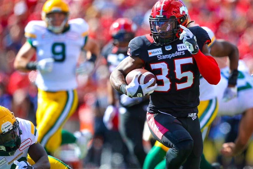 Calgary Stampeders running back Ka’Deem Carey rushes for a touchdown against the Edmonton Elks at McMahon Stadium in Calgary on Sept. 6, 2021.