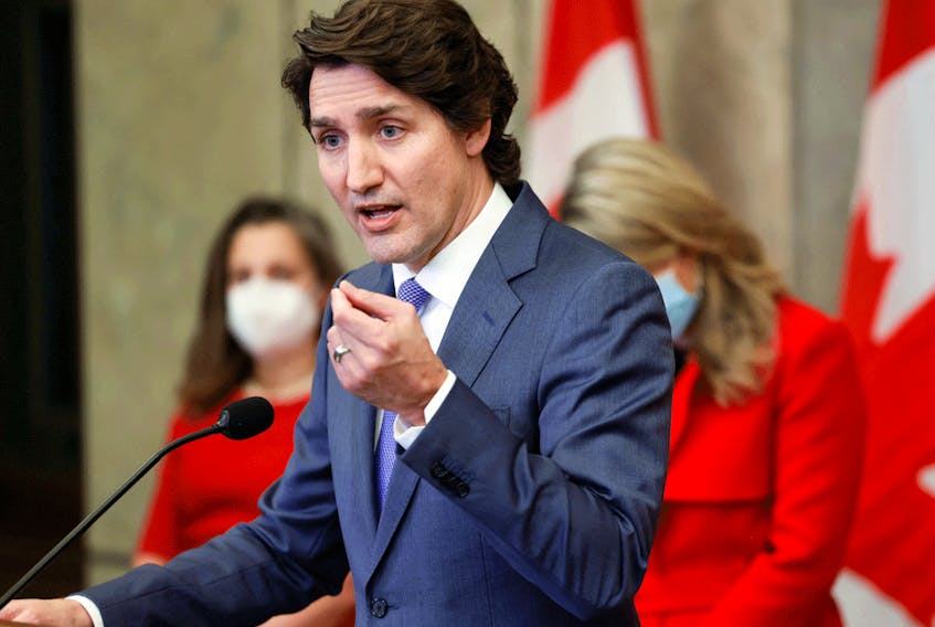 Prime Minister Justin Trudeau speaks during a news conference about Canada's military support for Ukraine, in Ottawa, January 26, 2022. On Monday, Trudeau spoke to reporters virtually as it was revealed he tested positive for COVID-19.