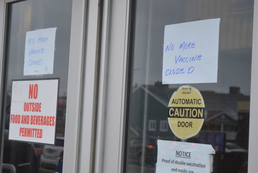 By around 11:45 a.m. Tuesday, the vaccine clinic at Centre 200 posted these signs in their front window. A second opening for the vaccine clinic will take place Wednesday. IAN NATHANSON • CAPE BRETON POST 
