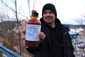 Ben Pumphrey has been a chef for over a decade and currently works at Bad Bones Ramen on Water Street. Lately, he's been using his free time to develop his new hot sauce company called Faucy Sucker. Here he holds one of the flavours called "Skeet Chili Heat" which he made in collaboration with Bad Bones Ramen.