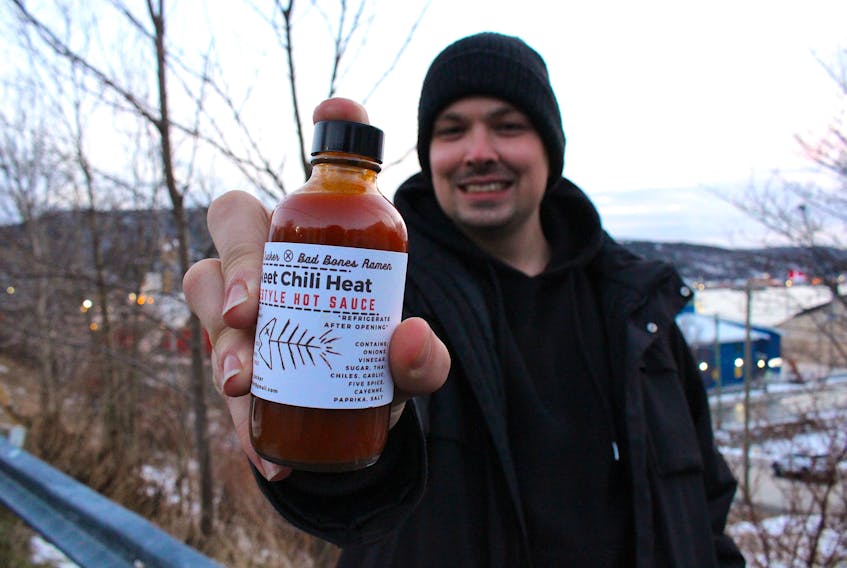 Ben Pumphrey has been a chef for over a decade and currently works at Bad Bones Ramen on Water Street. Lately, he's been using his free time to develop his new hot sauce company called Faucy Sucker. Here he holds one of the flavours called "Skeet Chili Heat" which he made in collaboration with Bad Bones Ramen.