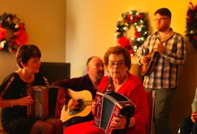 Clara Belle Fennelly (centre) was a well-known accordion player on the Southern Shore. Her grandson, Josh Ward — playing mandolin in the background — said his grandmother was a powerful force. Growing up, he took for granted how amazing it was to be surrounded by so much music, he said. CONTRIBUTED PHOTO