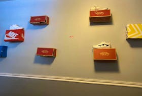 Megon Helfrich of Clutter Free Living had a teenaged client who loved sneakers. He mounted the boxes to the wall and displayed a shoe on each one. 