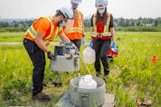  University of Calgary researchers check monitoring equipment as they track traces of COVID-19 in the wastewater system in Calgary on Wednesday, July 14, 2021.