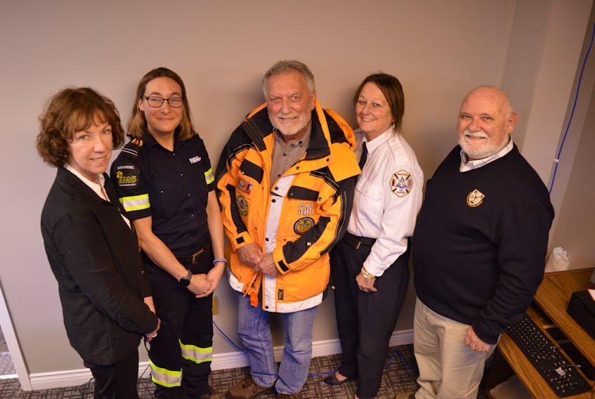 Critical incident stress management team members, Verna Ryan, left, paramedic Meghan Colvin-Daley, Ground Search and Rescue volunteer Tom White, fire prevention officer Cindy MacFadyen and corrections officer Shane Doran come from a variety of backgrounds to help other first responders talk through stressful events. 