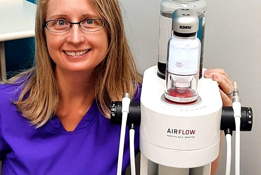 Dianna Major with “Betty.” Major’s business, Dental Magic Hygiene Studio in Middle Sackville, uses special technology such as Betty, an EMS Airflow Prophylaxis Master, that helps dental hygienists promote mouth health. CONTRIBUTED