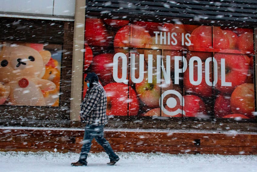 A pedestrian makes his way through the driving snow on Quinpool Road on Friday, Jan. 7, 2022.