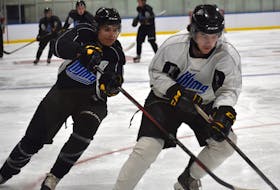 Cape Breton Eagles prospect Reese Allen, left, chases down Liam Trenholm during the club’s training camp at Miners Forum in Glace Bay in August. Allen, a South Bar product, is playing with the Sydney Mitsubishi Rush, while Trenholm, a Port Hood native, is with the Miramichi Timberwolves this year. JEREMY FRASER/CAPE BRETON POST.