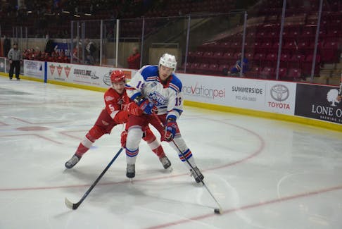 Summerside D. Alex MacDonald Ford Western Capitals forward Max-Antoine Melancon, 19, protects the puck from the Fredericton Red Wings’ Austin Black during a Maritime Junior Hockey League (MHL) game on Dec. 16. The Caps traded Melancon and a first-round draft pick in 2023 to the Pictou County Crushers for centre Jacob Stewart on Jan. 7.