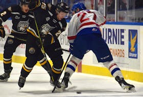 Dawson Stairs, left, works his way around a Moncton Wildcats defender during Quebec Major Junior Hockey League action at Centre 200 in Sydney earlier this season. The 19-year-old was traded to the Charlottetown Islanders on Jan. 6.