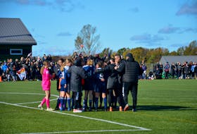 P.E.I. FC girls head coach Janos Barna, wearing sunglasses, talks to the team following the gold-medal game of the 2022 Toyota national championship U15 Cup at UPEI in Charlottetown on Oct. 10. Manitoba’s Winnipeg 1V1 Futbol Dreams defeated P.E.I. FC 2-0 in the gold-medal game. Jason Simmonds • The Guardian