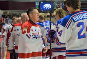 Charlie Cameron, the first captain in franchise history to win a league title with the Summerside Western Capitals, fist bumps Capitals forward Tate Brenner ahead of the Saturday, Oct. 8 game against the Fredericton Red Wings. The Capitals defeated the Red Wings 4-1 to stay undefeated (5-0-0) through the first five games of the regular season. Kyle Reid