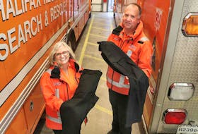 Halifax Regional Search and Rescue’s logistics co-ordinator Jess Pike, left, and public information officer Paul Service,  show off pants purchased through a provincial program that pays for up to 75 per cent of the costs of crucial gear for first responders. Contributed