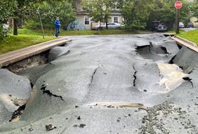 Flooding from overnight rain dropped by post-tropical storm Earl tore up parts of Old Patty Harbour Road and this section of Mooney Crescent in St. John’s on Sept. 12. Keith Gosse • The Telegram