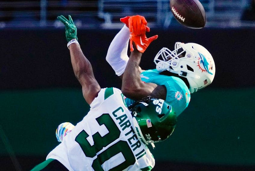 Oct 9, 2022; East Rutherford, N.J., USA; 
New York Jets cornerback Michael Carter II (30) is called for pass interference while defending Miami Dolphins wide receiver Jaylen Waddle (17) at MetLife Stadium.  