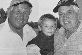Retired NHL hockey player Brad Park, left, was one of the special guests helping to raise money at a 2007 golf tournament for the Windsor Hockey Heritage Society. Pictured with him was 1973-74 Windsor Alpine captain Carl “Chook” Smith and his grandson Elijah Kendrick.