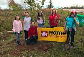 Raina Ellis, left, Kinsley Tremblay, Home Hardware manager Jamie Lewis, Lily Frase, Home Hardware employee Stepanie Roberts and Grace Sheehan were part of a tree planting event that saw L.M. Montgomery Elementary School plant over 175 trees on the Winter River watershed on Oct. 7. Contributed