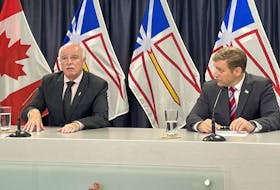 Health Minister Tom Osborne and Premier Andrew Furey speak with reporters during a live briefing announcing proposed amendments to the Medical Act which aim to make it easier for out-of-province doctors to practice in Newfoundland and Labrador. -Juanita Mercer/SaltWire Network