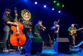 Ashley MacIsaac, centre, goes fiddle to fiddle with P.E.I.'s Gordie MacKeeman during a Celtic Colours performance. CONTRIBUTED/COREY KATZ PHOTOGRAPHY