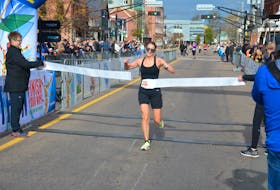 Sandra Cottreau of Charlottetown crosses the finish line in the P.E.I. Full Marathon event in Charlottetown on Oct. 16. The victory marked the third major win in 2022 for Cottreau, who won the Dunk River Road Race in Bedeque in July and the Harvest Festival 25K Road Race in Kensington in August. For more coverage of the P.E.I. Marathon, see page B1. Jason Simmonds • The Guardian