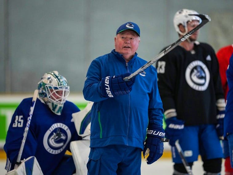 Vancouver Canucks coach Bruce Boudreau watches during the third