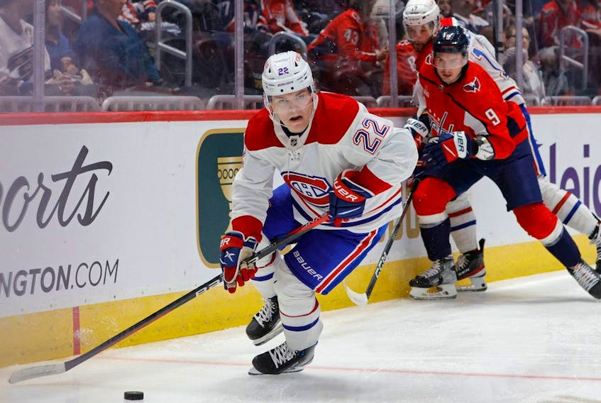 Montreal Canadiens right wing Cole Caufield (22) skates with the puck past Washington Capitals defenceman Dmitry Orlov (9) in the second period at Capital One Arena in Washington, D.C., on Saturday, October 15, 2022.