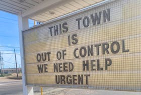 A sign outside a business in Happy Valley-Goose Bay pleads for help.