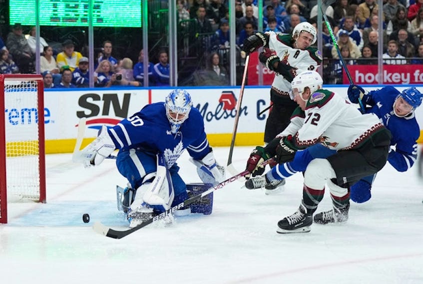 Arizona Coyotes' Nick Ritchie battles for the rebound in front of Maple Leafs goaltender Erik Kallgren during the second period at the Scotiabank Arena on Monday, Oct. 17, 2022. 