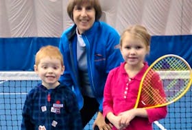 Encouraging young tennis players is important to Shelley Flemming, including Jeffrey Rau (left) and Meghan McCurdy.